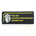 Embroidered patch with text 'You are overencumbered and cannot run!' on a black background